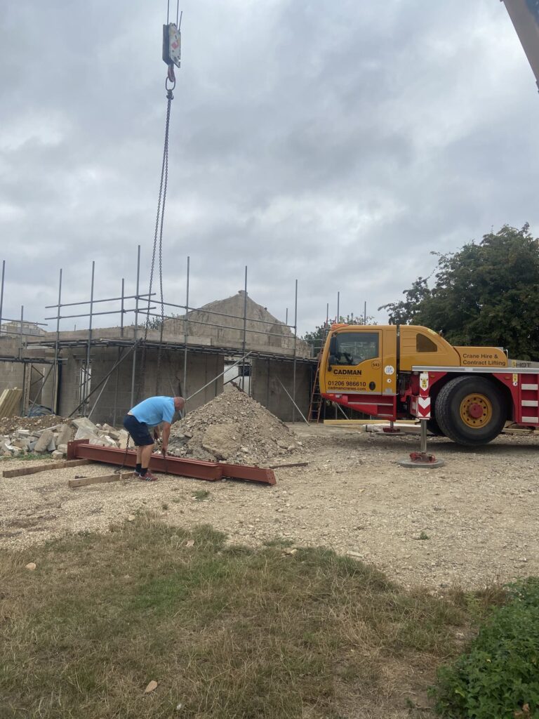 Crane lifting the steel work into place