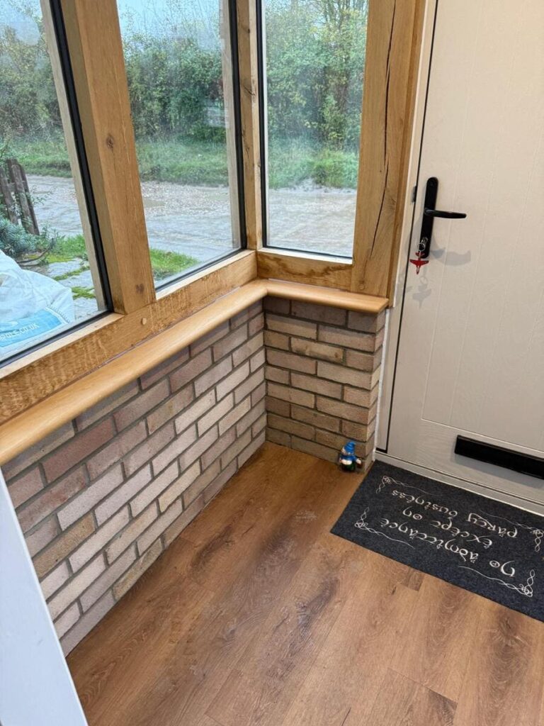 An inside view of an oak porch, showing the brickwork