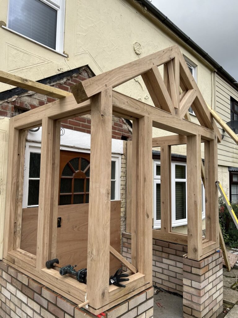 Work in progress image of the side view of an oak porch